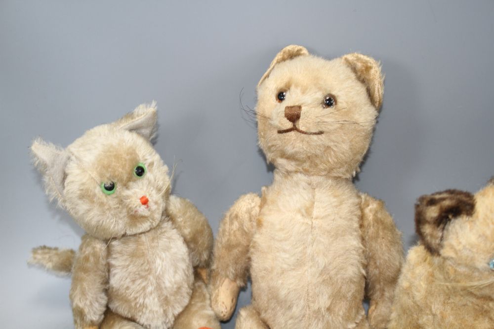 A collection of nine assorted vintage and later soft toy cats including Steiff